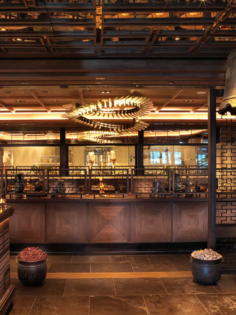 https://images.rosewoodhotels.com/is/image/rwhg/rosewood-abu-dhabi-dai-pai-dong-entrance-1%3ATALL-LARGE-9-16