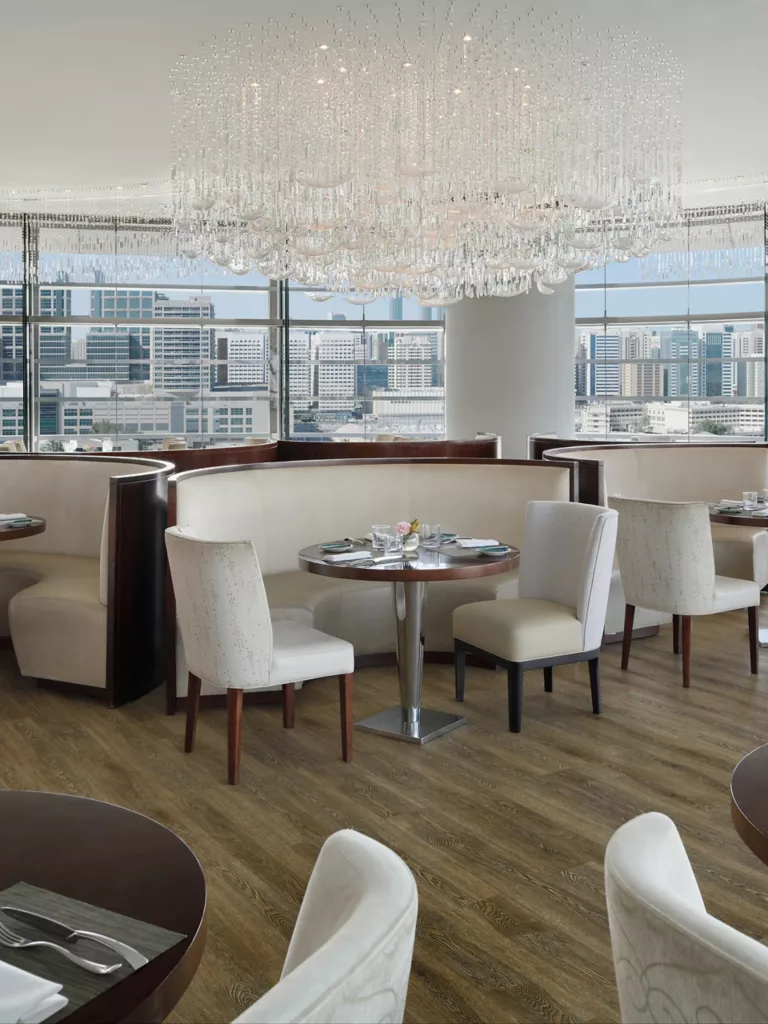 https://images.rosewoodhotels.com/is/image/rwhg/rwabu_dining_aqua%3ATALL-LARGE-9-16